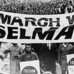 “Marchers Carrying Banner Lead Way as 15,000 Parade in Harlem” © New York World-Telegram and the Sun Newspaper; Stanley Wolfson, photographer; public domain